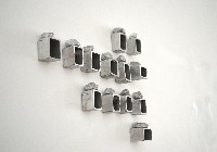 Mark Cloet, expositie/installatie 'C-Stone' 2013, sculpturen, i.e. stenen in dozen in aluminium, brons, kunststof (3D printer), vuursteen,

zilver, 4 x 7 x 1 cm. en goud, 6 x 3,2 x 0,8 cm.
PHŒBUS•Rotterdam